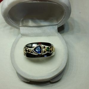 Silver band with sapphire blue, green, silver, & gold accents marked 925